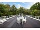 Rooftop deck with chairs, tables, and overhead tree coverage at 964 Dekalb Ne Ave # 112, Atlanta, GA 30307