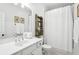 Classic bathroom with a white shower curtain, complemented by black and white tile floor at 1014 Seaboard Nw Ave, Atlanta, GA 30318