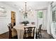 Traditional dining room with hardwood floors, wainscoting, and natural light at 1014 Seaboard Nw Ave, Atlanta, GA 30318