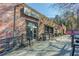 Brick building exterior with ramp access, string lights, and barrel planters for added charm and curb appeal at 1014 Seaboard Nw Ave, Atlanta, GA 30318