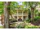 Charming two-story home boasting a double-decker porch, mature trees, and inviting curb appeal at 1014 Seaboard Nw Ave, Atlanta, GA 30318
