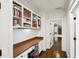 Hallway with built-in bookshelves and a desk, complemented by hardwood floors at 1014 Seaboard Nw Ave, Atlanta, GA 30318
