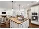 View of the open concept kitchen featuring a gas stovetop and stainless appliances with living area nearby at 1014 Seaboard Nw Ave, Atlanta, GA 30318