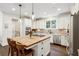 Bright kitchen featuring stainless appliances, wood island with seating and granite counter, and pendant lighting at 1014 Seaboard Nw Ave, Atlanta, GA 30318