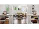 Bright living room with hardwood floors, white trim, and built in bookcases at 1014 Seaboard Nw Ave, Atlanta, GA 30318