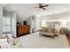 Spacious main bedroom with decorative ceiling fan, sitting area, and large windows for natural light at 1014 Seaboard Nw Ave, Atlanta, GA 30318