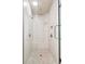 Walk-in shower features pebble floor, bench, and multiple shower heads at 1014 Seaboard Nw Ave, Atlanta, GA 30318