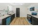 Renovated kitchen with stainless appliances and a modern color scheme at 102 Aristocratic Way, Locust Grove, GA 30248