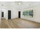 Open living room with hardwood floors, vaulted ceiling, and natural light at 102 Aristocratic Way, Locust Grove, GA 30248