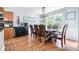 Elegant dining room with a large window and hardwood floors at 1211 Fly Rod Ln, Loganville, GA 30052