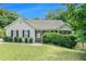 Charming one-story home with a well-manicured front yard and inviting front porch at 1211 Fly Rod Ln, Loganville, GA 30052