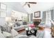 Cozy living room with a stone fireplace and comfortable seating at 1211 Fly Rod Ln, Loganville, GA 30052
