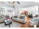 Open concept living room and kitchen with hardwood floors at 1211 Fly Rod Ln, Loganville, GA 30052