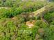 Stunning aerial view of 2228 Walker Drive home nestled amongst a beautiful canopy of green trees at 2228 Walker Dr, Lawrenceville, GA 30043