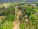 Aerial view of golf course running through a mature tree-lined community at 2228 Walker Dr, Lawrenceville, GA 30043