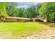 Spacious backyard with lush lawn, ideal for outdoor activities and gatherings at 2228 Walker Dr, Lawrenceville, GA 30043