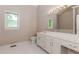 Bathroom features a large vanity with cabinetry, tile flooring, and a large mirror at 2228 Walker Dr, Lawrenceville, GA 30043
