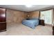 Cozy bedroom featuring carpet, a ceiling fan, and warm-toned walls at 2228 Walker Dr, Lawrenceville, GA 30043