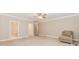 Large bedroom boasts neutral decor and carpet, providing a blank canvas for personalization at 2228 Walker Dr, Lawrenceville, GA 30043