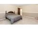 This bedroom features neutral paint, carpet, and view to other rooms at 2228 Walker Dr, Lawrenceville, GA 30043