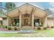 Inviting front porch with brick accents, steps, and rocking chairs, leading to an attractive front door at 2228 Walker Dr, Lawrenceville, GA 30043
