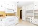 Spacious kitchen with white cabinets, ample counter space, and an adjacent dining area at 2228 Walker Dr, Lawrenceville, GA 30043