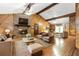 Cozy living room with a fireplace, hardwood floors, and exposed wood beams for rustic charm at 2228 Walker Dr, Lawrenceville, GA 30043