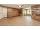 Spacious living room featuring beautiful wood paneling, updated flooring, and abundant natural light at 2228 Walker Dr, Lawrenceville, GA 30043