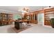 Office featuring built-in wooden cabinets, a large desk with a leather chair, and an area rug at 2228 Walker Dr, Lawrenceville, GA 30043