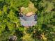 Secluded home nestled among mature trees featuring a large deck perfect for enjoying the outdoors at 2279 Parkview Cir, College Park, GA 30337