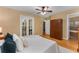The bedroom features hardwood floors and a view into the bathroom, with an exterior balcony at 2279 Parkview Cir, College Park, GA 30337