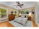Bright bedroom featuring hardwood floors, a neutral color palette, a ceiling fan, and natural light at 2279 Parkview Cir, College Park, GA 30337