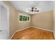 Cozy bedroom features natural light, hardwood floors, a ceiling fan, and neutral walls, creating a relaxing atmosphere at 2279 Parkview Cir, College Park, GA 30337