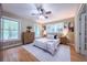 Serene bedroom with hardwood floors, and natural light from large windows at 2279 Parkview Cir, College Park, GA 30337