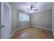 Bedroom featuring hardwood flooring, ceiling fan, one window, and neutral paint at 2279 Parkview Cir, College Park, GA 30337