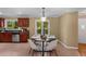 Cozy dining area featuring a black table, stylish seating and natural light from nearby windows at 2279 Parkview Cir, College Park, GA 30337