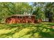 Charming single-story brick home surrounded by mature trees and a well-maintained lawn at 2279 Parkview Cir, College Park, GA 30337