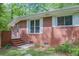 A red brick exterior with white window trim and a charming stone walkway at 2279 Parkview Cir, College Park, GA 30337
