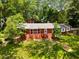 Inviting brick home with a large front yard and mature trees creating a serene setting at 2279 Parkview Cir, College Park, GA 30337