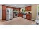 Eat-in kitchen features wooden cabinets and stainless steel appliances under bright natural light at 2279 Parkview Cir, College Park, GA 30337