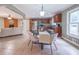 Bright, open kitchen with stainless steel appliances and a dining area with modern lighting at 2279 Parkview Cir, College Park, GA 30337