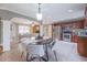 Eat-in kitchen with stainless steel appliances, dark wood cabinets, and tile flooring at 2279 Parkview Cir, College Park, GA 30337