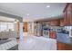 Spacious kitchen featuring stainless steel appliances, tile flooring, and an open layout to the living area at 2279 Parkview Cir, College Park, GA 30337