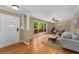 Bright living room with hardwood floors, ceiling fan and access to the brick patio at 2279 Parkview Cir, College Park, GA 30337