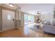 Bright living room featuring hardwood floors, a large window, and a stylish entrance door at 2279 Parkview Cir, College Park, GA 30337