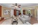 View of the open floor plan from the living room to the kitchen and dining area with hardwood-look flooring at 2279 Parkview Cir, College Park, GA 30337