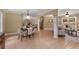Open-concept living space with neutral walls and decor is connected to the dining area with an open doorway at 2279 Parkview Cir, College Park, GA 30337