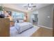 Cozy bedroom with a ceiling fan, natural light, and access to an additional room at 2279 Parkview Cir, College Park, GA 30337