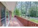 Outdoor patio with brick lattice, offering a view of the surrounding trees at 2279 Parkview Cir, College Park, GA 30337