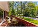 A brick patio features outdoor furniture and provides a view of the lush green lawn and surrounding trees at 2279 Parkview Cir, College Park, GA 30337